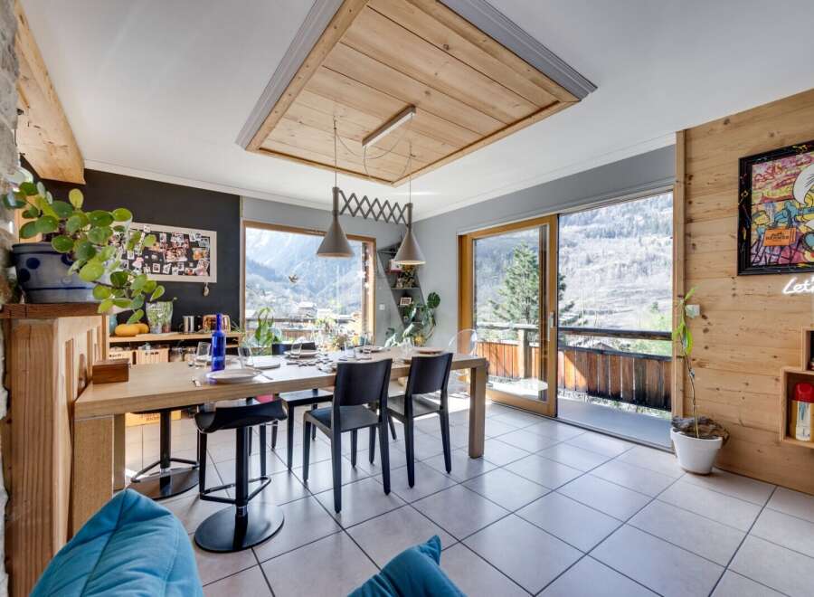 This stunning dining area boasts a modern design with a touch of rustic charm.
