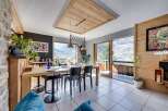 This stunning dining area boasts a modern design with a touch of rustic charm.