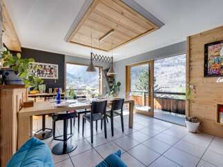 This stunning dining area boasts a modern design with a touch of rustic charm.