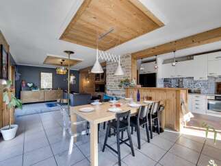 This stunning property boasts a seamless blend of rustic charm and modern elegance.