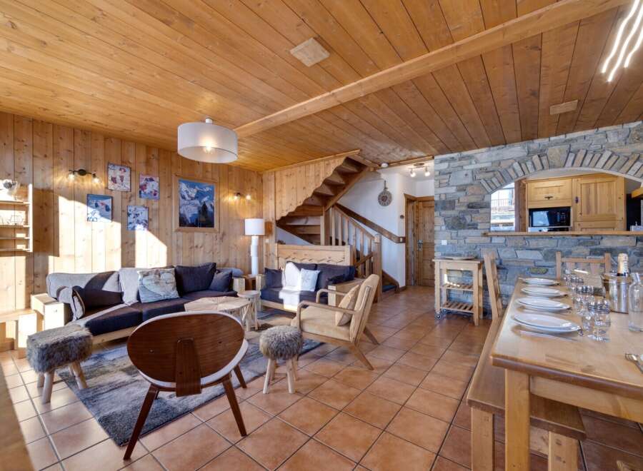 This stunning property boasts a warm and inviting interior with beautiful wooden accents throughout.