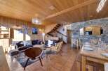 This stunning property boasts a warm and inviting interior with beautiful wooden accents throughout.