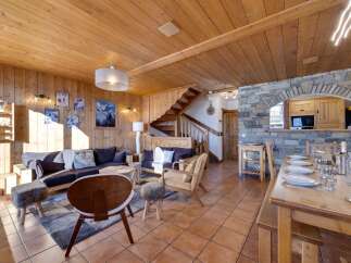 This stunning property boasts a warm and inviting interior with beautiful wooden accents throughout.
