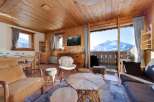 Experience the charm of this cozy chalet, boasting stunning mountain views from its balcony.