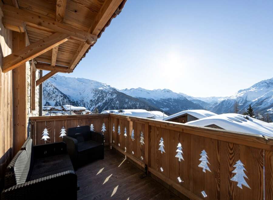 Enjoy breathtaking mountain views from this stunning balcony.
