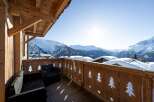 Enjoy breathtaking mountain views from this stunning balcony.