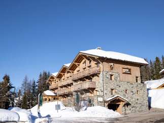 Discover the charm of this stunning chalet nestled in a picturesque winter wonderland.