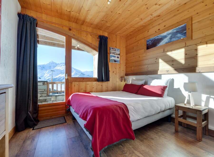 Experience the ultimate mountain retreat in this cozy bedroom.