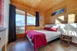 Experience the ultimate mountain retreat in this cozy bedroom.