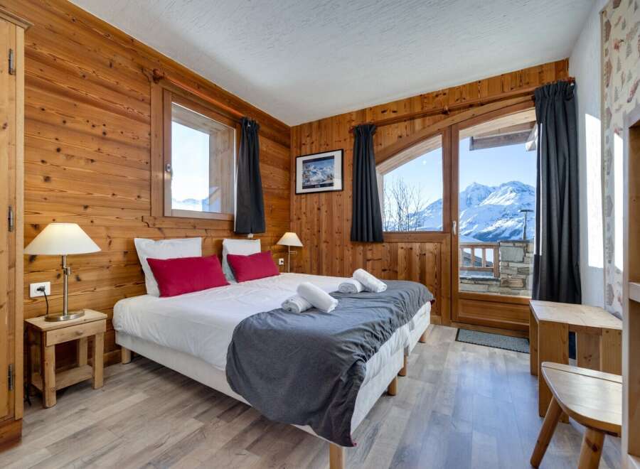 Experience the ultimate mountain retreat in this cozy bedroom.