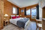Experience the ultimate mountain retreat in this cozy bedroom.