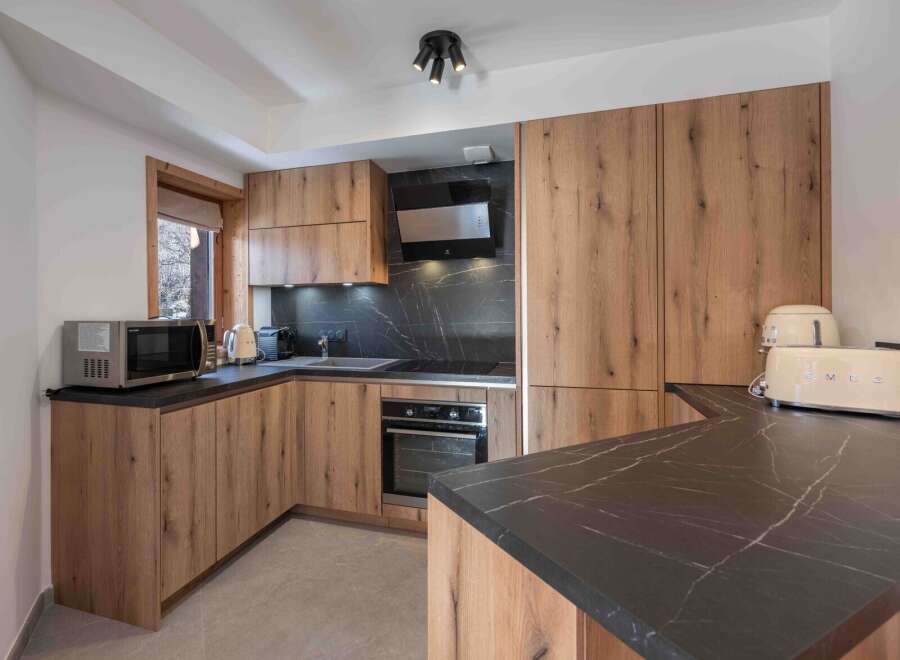 This stunning kitchen boasts modern design with a touch of rustic charm.
