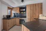 This stunning kitchen boasts modern design with a touch of rustic charm.