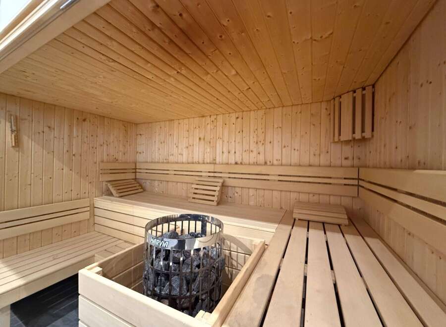 Step into relaxation with this stunning sauna.