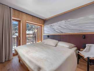 Experience the ultimate in alpine luxury with this stunning bedroom.
