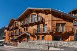 Discover the charm of this stunning wooden chalet, perfectly nestled in a picturesque mountain setting.