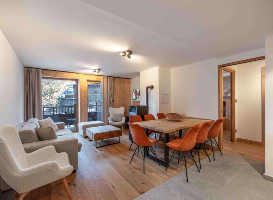 Experience the charm of this stunning property, featuring a cozy living area with a fireplace and a dining space perfect for gatherings.
