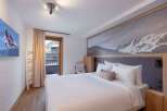 Experience luxury and comfort in this stunning bedroom.