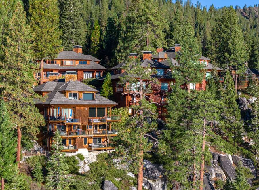 Nestled amidst lush greenery, this stunning property boasts multiple levels of luxurious living spaces.