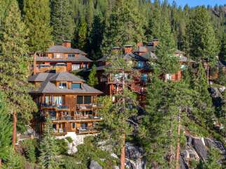 Nestled amidst lush greenery, this stunning property boasts multiple levels of luxurious living spaces.