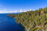 Nestled along the pristine shoreline, this stunning property offers unparalleled views of the crystal-clear lake.