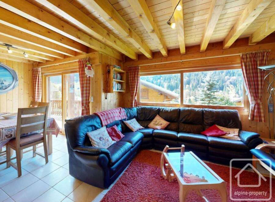 Discover the charm of this cozy property, featuring a spacious living area with a comfortable leather sofa.