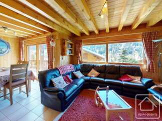 Discover the charm of this cozy property, featuring a spacious living area with a comfortable leather sofa.