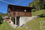 Discover this charming chalet nestled in a picturesque mountain setting.