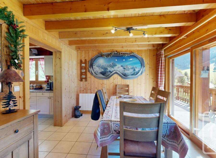 Step into this charming chalet-style dining area, perfect for cozy gatherings.