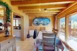 Step into this charming chalet-style dining area, perfect for cozy gatherings.