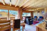 Experience the charm of this cozy chalet, featuring stunning wooden interiors and panoramic views.