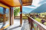 Enjoy breathtaking mountain views from this charming chalet.
