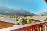 Experience breathtaking mountain views from this charming property.
