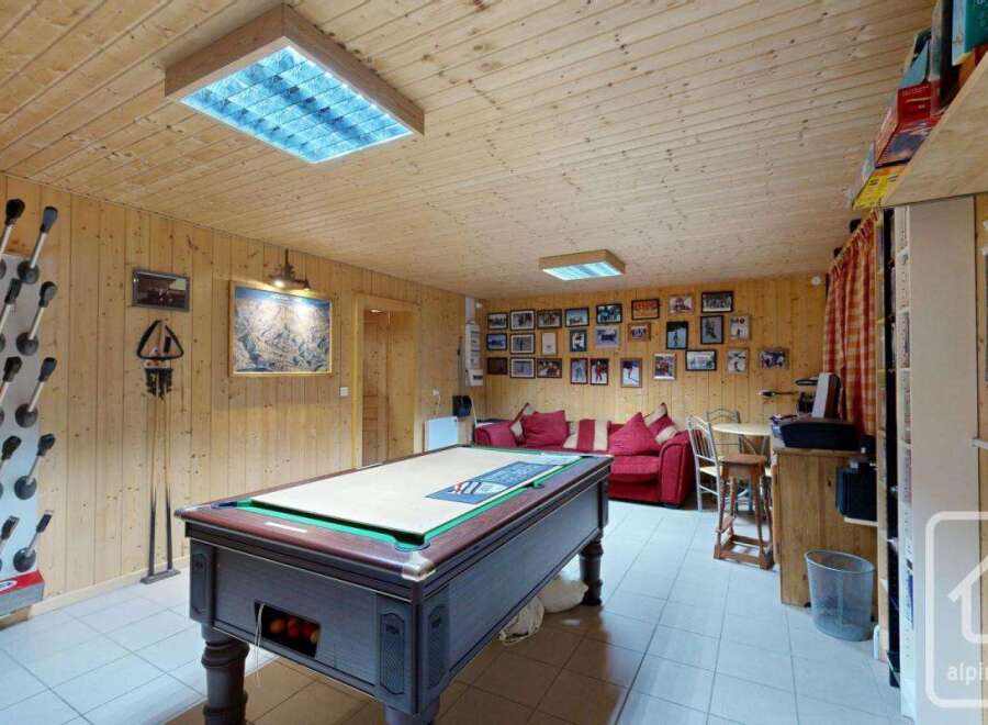 This cozy property features a spacious game room, perfect for entertaining.
