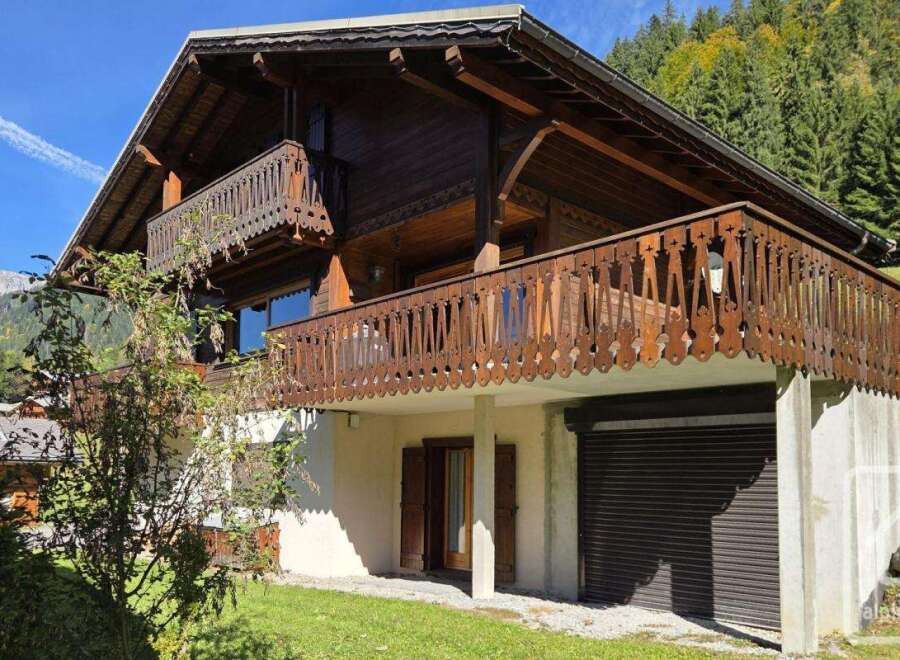 Discover a charming wooden chalet nestled in a picturesque mountain setting.