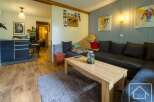 Discover this inviting living space, perfect for relaxation and entertaining.