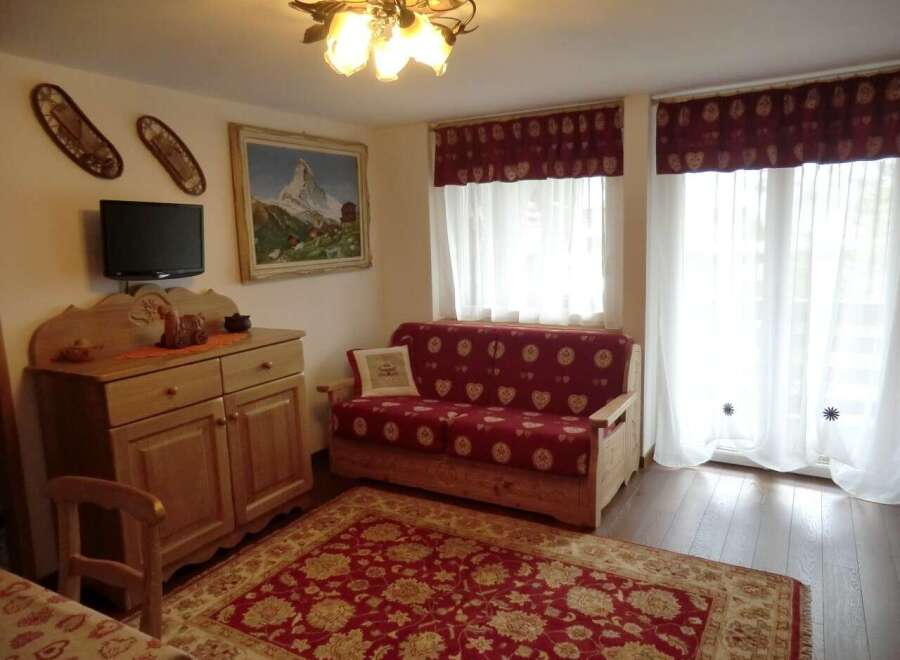 Step into this charming living space, perfect for relaxation and entertaining.