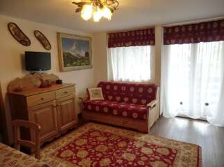 Step into this charming living space, perfect for relaxation and entertaining.