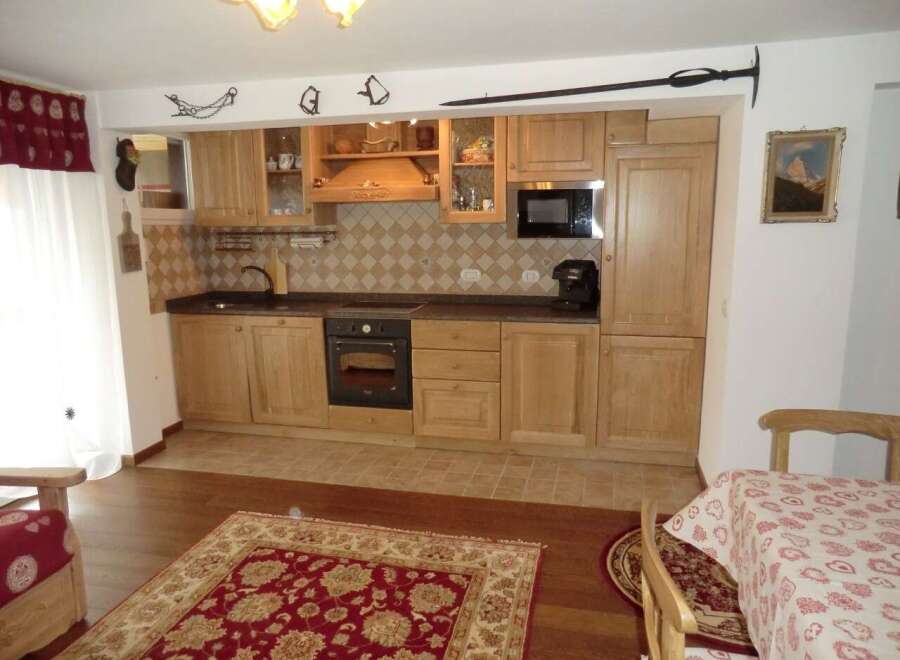 This charming kitchen boasts a warm and inviting atmosphere, perfect for culinary adventures.