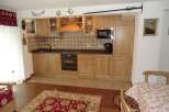 This charming kitchen boasts a warm and inviting atmosphere, perfect for culinary adventures.