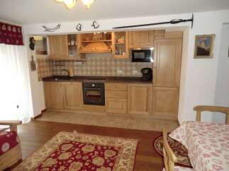 This charming kitchen boasts a warm and inviting atmosphere, perfect for culinary adventures.