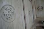 This property features custom woodwork, including intricate snowflake designs on the cabinet doors.