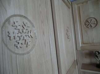 This property features custom woodwork, including intricate snowflake designs on the cabinet doors.