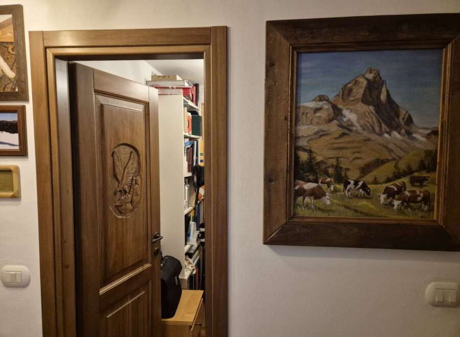Discover the charm of this unique property, featuring a beautifully carved wooden door that leads to a hidden library.