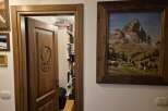 Discover the charm of this unique property, featuring a beautifully carved wooden door that leads to a hidden library.