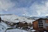 Discover the charm of mountain living in this stunning property, nestled amidst a picturesque snow-covered landscape.