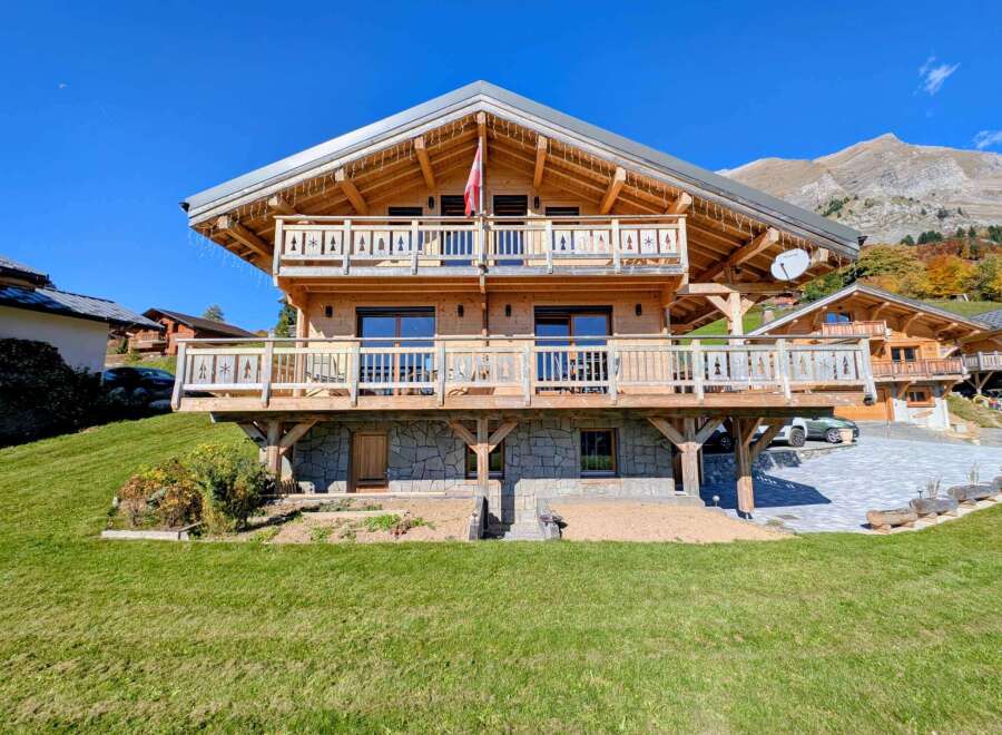 This stunning wooden chalet offers a perfect blend of rustic charm and modern comfort.