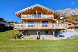 This stunning wooden chalet offers a perfect blend of rustic charm and modern comfort.