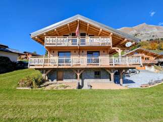 This stunning wooden chalet offers a perfect blend of rustic charm and modern comfort.
