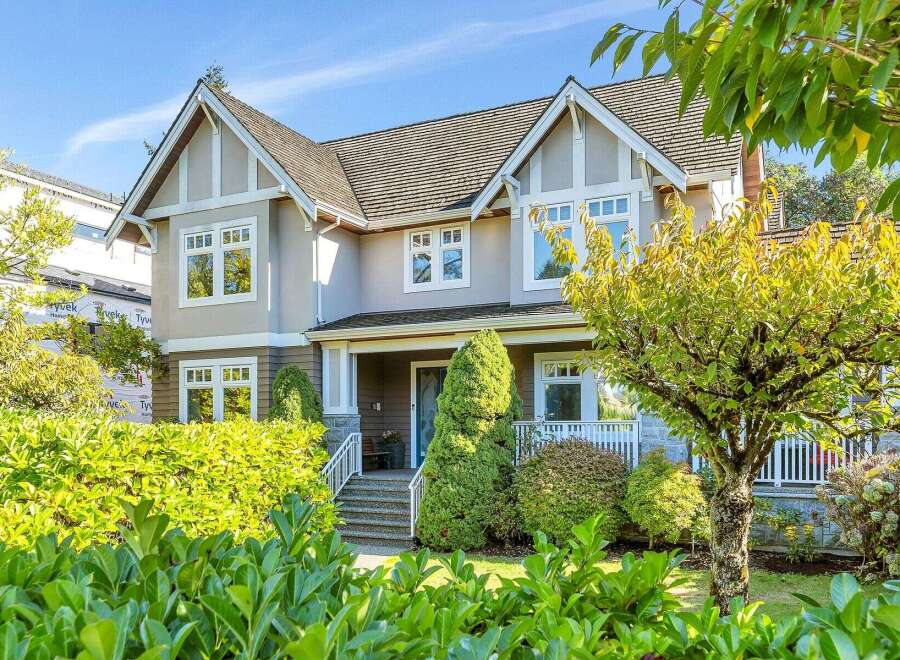 This stunning property boasts a beautiful exterior with a well-maintained yard and lush landscaping.